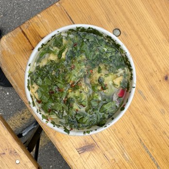 My Pozole - a bowl of spinach on a wooden table - Food Trucks Near Me - San Diego, California My Pozole - a bowl of spinach on a wooden table - Food Trucks Near Me - San Diego, California