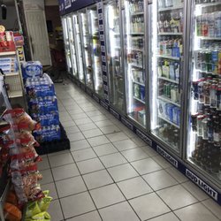 King's Meat Market & Grocery - Cases of water, beer, and soft drinks.