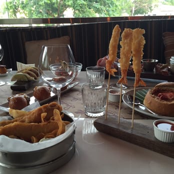 Semilla - French Fries with a cheese sauce  Shrimp Tempura - French Near Me - Miami Beach, Florida