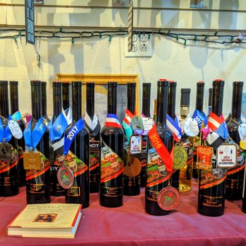 Spero Winery - a table full of bottles of wine - Wineries Near Me - Denver, Colorado Spero Winery - a table full of bottles of wine - Wineries Near Me - Denver, Colorado