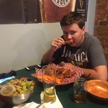 Yanks Old Niagara Bar and Grill - Son eating wings - American Near Me - Niagara Falls, Ontario Yanks Old Niagara Bar and Grill - Son eating wings - American Near Me - Niagara Falls, Ontario