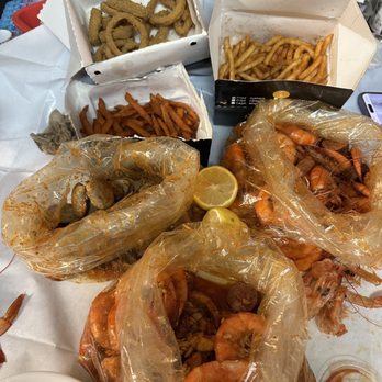 The Boiling Crab - 3lbs of shrimp, 1 lb of clams, calamari, sweet potato fries, and cajun fries - Cajun/Creole Near Me - Rosemead, California The Boiling Crab - 3lbs of shrimp, 1 lb of clams, calamari, sweet potato fries, and cajun fries - Cajun/Creole Near Me - Rosemead, California