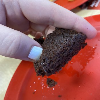 Cicis Pizza - a hand holding a piece of cake - Pizza Near Me - Tulsa, Oklahoma