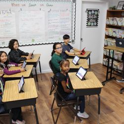 Hickory Tree School - Our elementary classes are provided iPads for supplemental learning and break time fun,