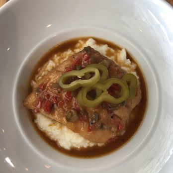 Rue Saint Marc - Pan roasted fish and grits with Cajun butter sauce - French Near Me - Jacksonville, Florida Rue Saint Marc - Pan roasted fish and grits with Cajun butter sauce - French Near Me - Jacksonville, Florida