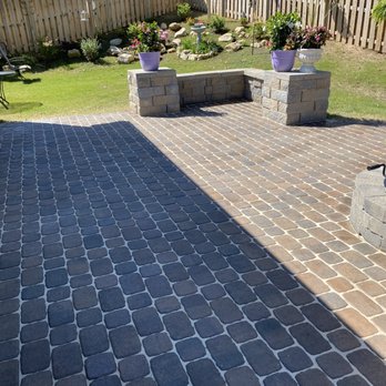 Lawn Vets Outdoors - a brick patio with a fire pit - Landscaping Near Me Lawn Vets Outdoors - a brick patio with a fire pit - Landscaping Near Me