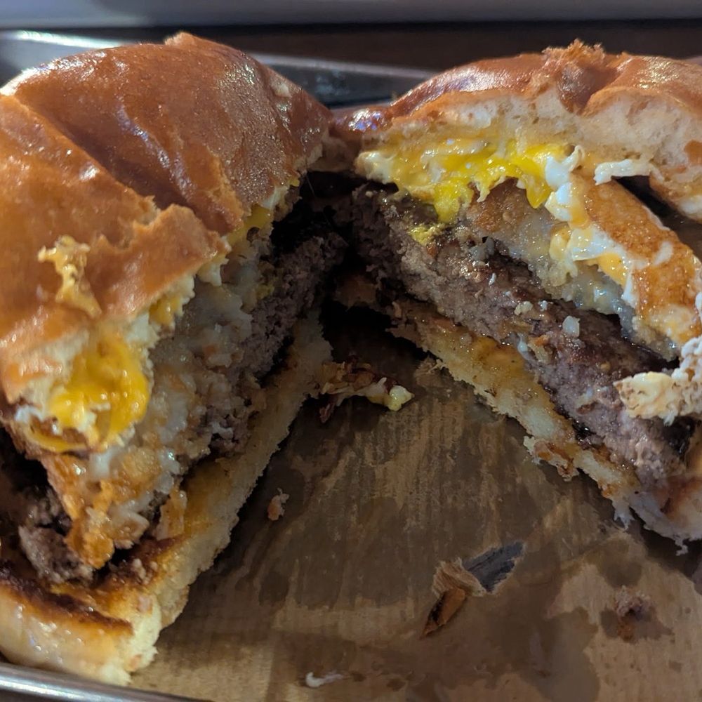 The District Pub & Grill - Warm Up Burger - New American Near Me - Eau Claire, Wisconsin The District Pub & Grill - Warm Up Burger - New American Near Me - Eau Claire, Wisconsin