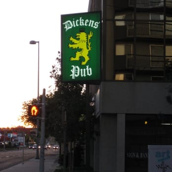 Dickens Pub - a green sign with a lion on it - Pubs Near Me - Calgary, Alberta Dickens Pub - a green sign with a lion on it - Pubs Near Me - Calgary, Alberta