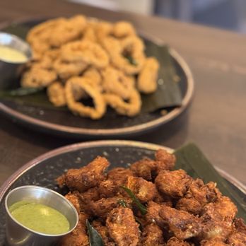 Delhi Darling - Front: popcorn gobi (pop corn cauliflower) and Masala Crusted Calamari Rings. - Bars Near Me - Hampstead, North Carolina Delhi Darling - Front: popcorn gobi (pop corn cauliflower) and Masala Crusted Calamari Rings. - Bars Near Me - Hampstead, North Carolina