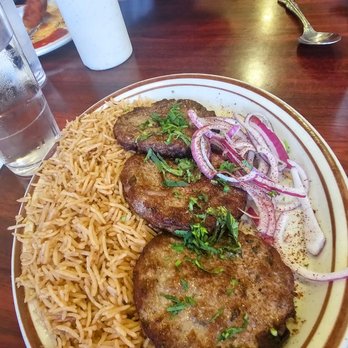 Dunya Kabab House - Chapli Kabob- Sizzling pan-fried ground beef patties mixed with fresh vegetables. $15. Lighter spiced than the Pakistani version, but tasty - Afghan Near Me - Brooklyn, New York