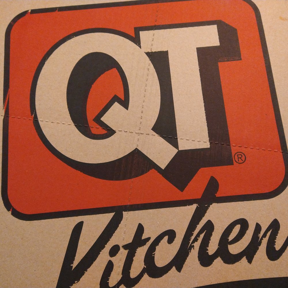 QuikTrip - the qt kitchen logo on a pizza box - Gas Stations Near Me - Maricopa, Arizona QuikTrip - the qt kitchen logo on a pizza box - Gas Stations Near Me - Maricopa, Arizona
