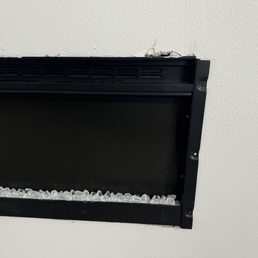This is the way they cut the wall to put the fire place in and thought it was ok because the glass covering to the fireplace would cover it. This is the way they cut the wall to put the fire place in and thought it was ok because the glass covering to the fireplace would cover it.