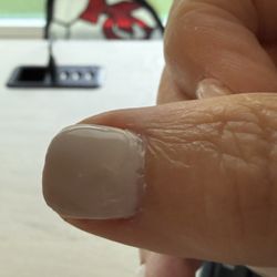 BellaVi Day Spa - It was a dip manicure, but she left gaps around the nail bed and painted over the gaps.
