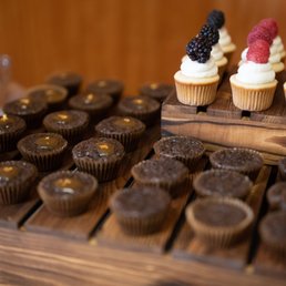 a display of cupcakes and muffins a display of cupcakes and muffins