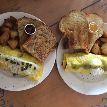 Blue Fox Cafe - Left: Salish Salmon Omelette with Sour Dough Toast Right: Spanish Flying Omelette with Multigrain Toast - Breakfast & Brunch Near Me - Victoria, British Columbia