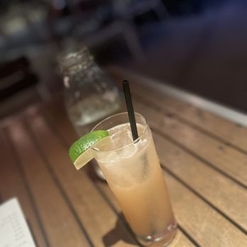 STIR - a drink on a wooden table - Cocktail Bars Near Me - Chattanooga, Tennessee