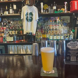 a glass of beer on the bar