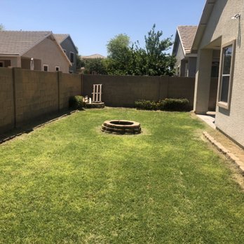 Lmryardcare - a backyard with a fire pit - Lawn Services Near Me Lmryardcare - a backyard with a fire pit - Lawn Services Near Me