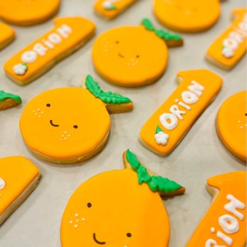 Sugar Faced Bay Area - orange cookies with name tags - Desserts Near Me Sugar Faced Bay Area - orange cookies with name tags - Desserts Near Me