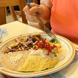 Panamá - Special holiday December omelette with chilaquiles and refríes beans. So good!