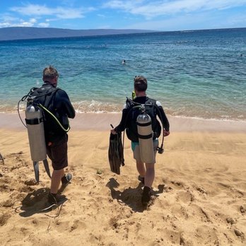 Extended Horizons Scuba - All geared up and heading into the water at Kahekili Beach Park for my first dive. - Diving Near Me - Lahaina, Hawaii
