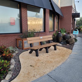 The Great Oasis - a bench in front of a building - Landscaping Near Me The Great Oasis - a bench in front of a building - Landscaping Near Me