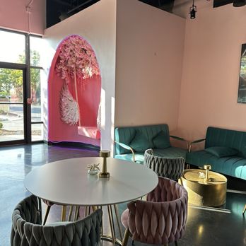 Chérie Cafe & Lounge - Seating with pink photo op and tv - Hookah Bars Near Me - Sterling, Virginia