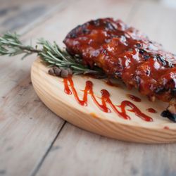 Nikosi - 1/2 rack of boar ribs glazed in our house-made maple-whiskey BBQ sauce.