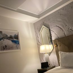 Art, mirror, lovely walls, and the best sight after travel- the bed Art, mirror, lovely walls, and the best sight after travel- the bed