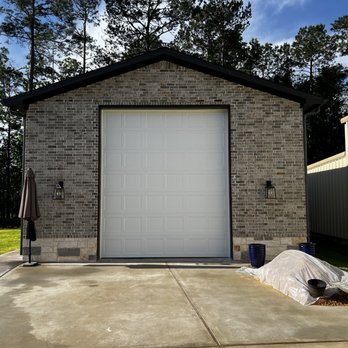 Modern Home Improvement & Remodeling - New 12'x14' Door - General Contractors Near Me
