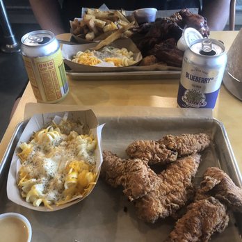 Boss ChickNBeer - In the front is the four pack, in the back you can see the wing and tender combo with mac n cheese and fries. - Chicken Wings Near Me - Berea, Ohio