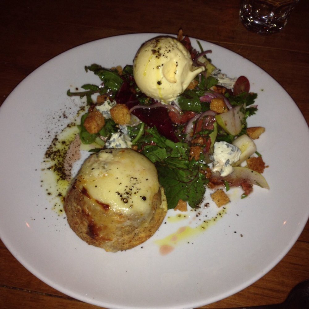 Double baked blue cheese soufflé with blue cheese ice cream over with pears, walnut and bitter leaves salad - yummo