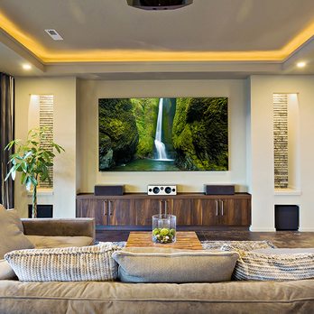 3rd Block Group, A Limited Liability Company - a living room with a tv and a waterfall - General Contractors Near Me 3rd Block Group, A Limited Liability Company - a living room with a tv and a waterfall - General Contractors Near Me
