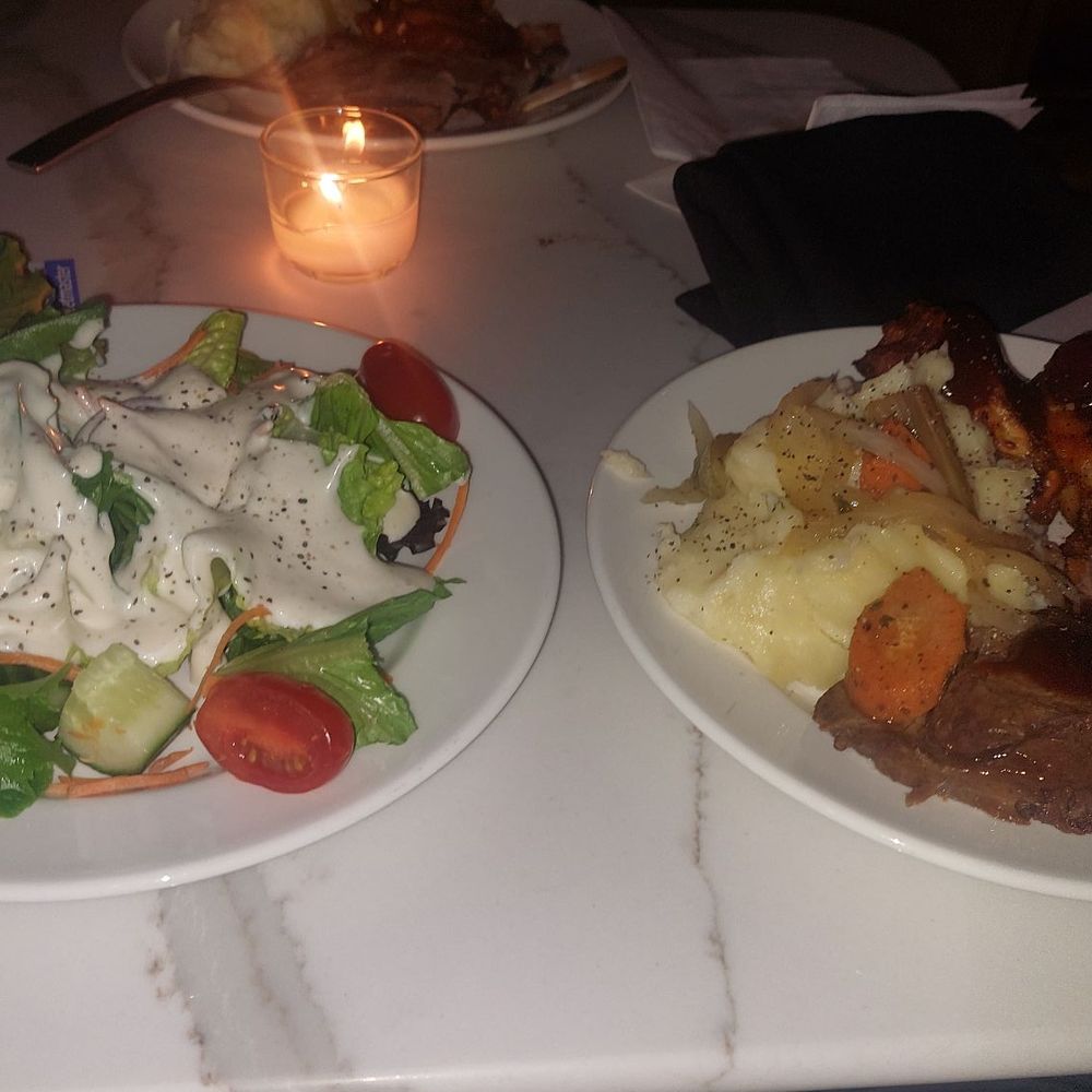 Sound Board - Candle lit dinner with a house salad, garlic mashed potatoes, grilled onions, steamed carrots and pot roast with savory bourbon sauce - Music Venues Near Me - Detroit, Michigan Sound Board - Candle lit dinner with a house salad, garlic mashed potatoes, grilled onions, steamed carrots and pot roast with savory bourbon sauce - Music Venues Near Me - Detroit, Michigan