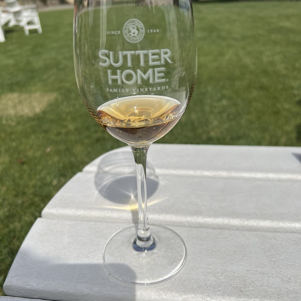 Sutter Home Winery - a glass of wine on a table - Wineries Near Me - Saint Helena, California Sutter Home Winery - a glass of wine on a table - Wineries Near Me - Saint Helena, California
