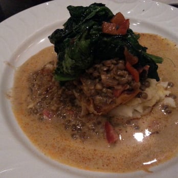 John Gray's Kitchen - This is the fish dish that my boss had. Its fish on top of mash potatoes, topped with lintel and spinach - International Near Me - Puerto Morelos, ROO John Gray's Kitchen - This is the fish dish that my boss had. Its fish on top of mash potatoes, topped with lintel and spinach - International Near Me - Puerto Morelos, ROO