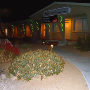 Atomic Inn - The front of Atomic Inn with two cats - Hotels Near Me - Beatty, Nevada