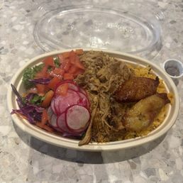 Cotoita, build your own bowl. Rice, pork, salad, tomato's, plantains, and radish. Cotoita, build your own bowl. Rice, pork, salad, tomato's, plantains, and radish.