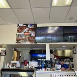 Primo Pizza - As you walk in, on the counter, it is directly in front of you.