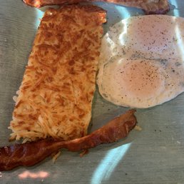 Two eggs over easy and hash browns Two eggs over easy and hash browns