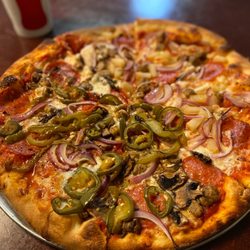 Terra Mia Pizzeria - Hawaiian Pizza & 3. Deluxe Pie half & half.