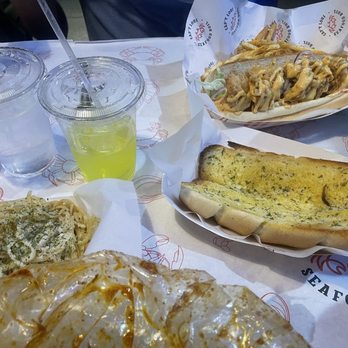 Capt Loui - Shrimp Po'Boy, garlic bread and garlic noodles. Everything was super delicious. - Seafood Near Me - Carrollton, Texas Capt Loui - Shrimp Po'Boy, garlic bread and garlic noodles. Everything was super delicious. - Seafood Near Me - Carrollton, Texas
