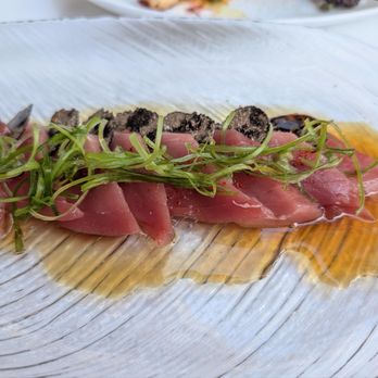 Pisces - Aged blue fine chutoro, worth getting as every slice accompanied by a 4x4mm black truffle. Ponzu helps highlight aged flavor - Mediterranean Near Me - Las Vegas, Nevada Pisces - Aged blue fine chutoro, worth getting as every slice accompanied by a 4x4mm black truffle. Ponzu helps highlight aged flavor - Mediterranean Near Me - Las Vegas, Nevada