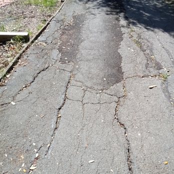 RSR Development Design + Build - Example of damage to my driveway due to the Reddy's putting their drainage onto my property, illegal!!! - General Contractors Near Me - Alamo, California RSR Development Design + Build - Example of damage to my driveway due to the Reddy's putting their drainage onto my property, illegal!!! - General Contractors Near Me - Alamo, California