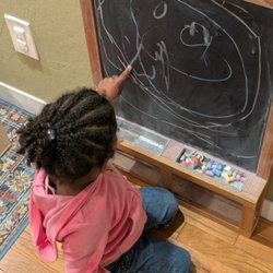 Oakland Community Montessori School - What children experience as play, we know to be the beginning of writing skills.