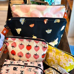 Discover the latest Ribbon Street fabric bags, featuring a variety of stylish prints and practical designs...