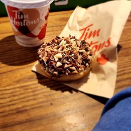 a donut and a cup of coffee a donut and a cup of coffee