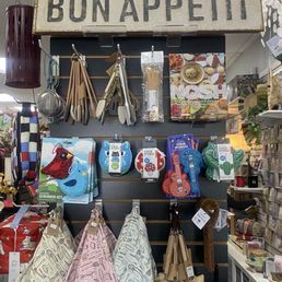 Kitchen supplies and a variety of table setting items, like napkins, towels, and tablecloths Kitchen supplies and a variety of table setting items, like napkins, towels, and tablecloths