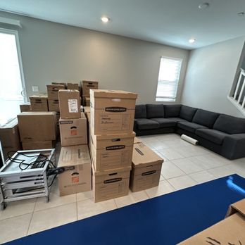 Level15 Moving - Our boxes packed ready to go with their blue carpet - Movers Near Me - Las Vegas, Nevada Level15 Moving - Our boxes packed ready to go with their blue carpet - Movers Near Me - Las Vegas, Nevada