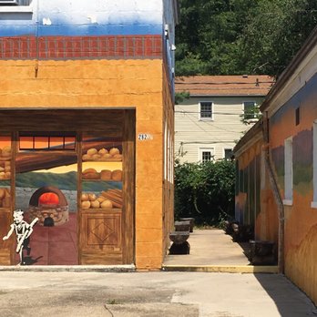 Athens Bread Company - Sweet murals and alley with log benches - Bakeries Near Me - Athens, Ohio